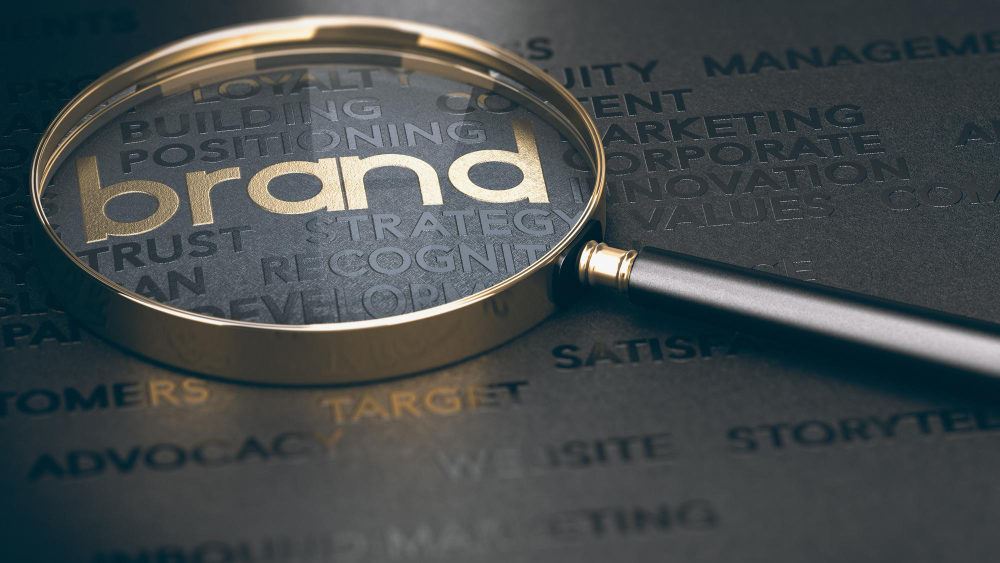the word brand being highlighted using a magnifying glass
